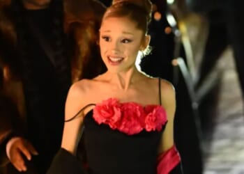 Ariana Grande stuns in floral dress as she enjoys night out with co-stars in Paris ahead of Wicked sequel release