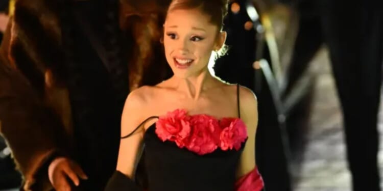 Ariana Grande stuns in floral dress as she enjoys night out with co-stars in Paris ahead of Wicked sequel release