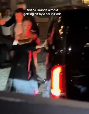 A shocked Grande looked terrified as the car started barreling towards her, stopping just inches from her body