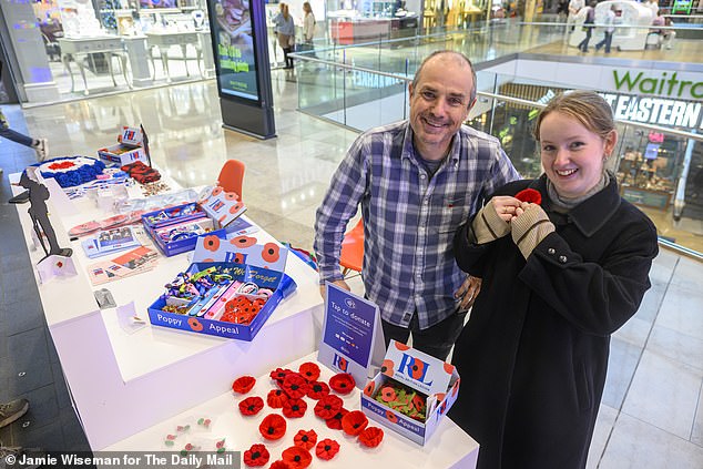 Inside Westfield in Stratford, poppy seller Liam Adam said he was doing brisk business at his stall