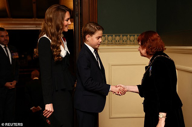 A future King in training! George shakes hands upon his arrival at the