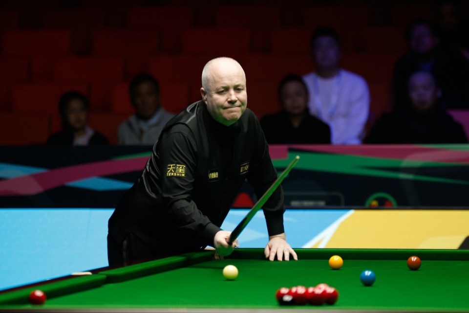 A male snooker player, Tony Drago, bent over a snooker table, holding a cue stick, during the International Championship 2025.