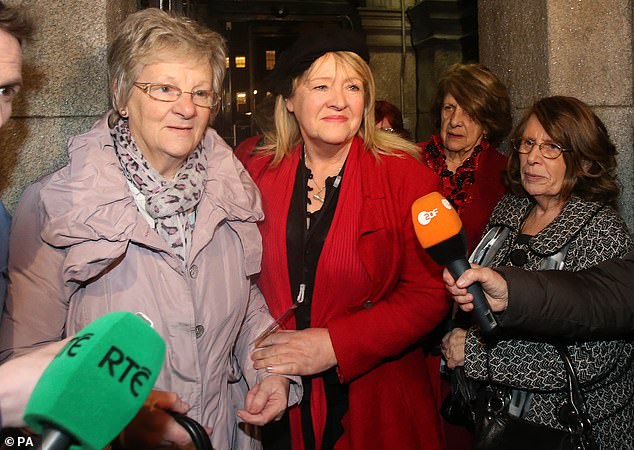 Marina Gambold (left) and Maureen Sullivan (centre) of campaign group Magdalene Survivors Together leaving Leinster House in Dublin after hearing Taoiseach Enda Kenny's state apology in 2013