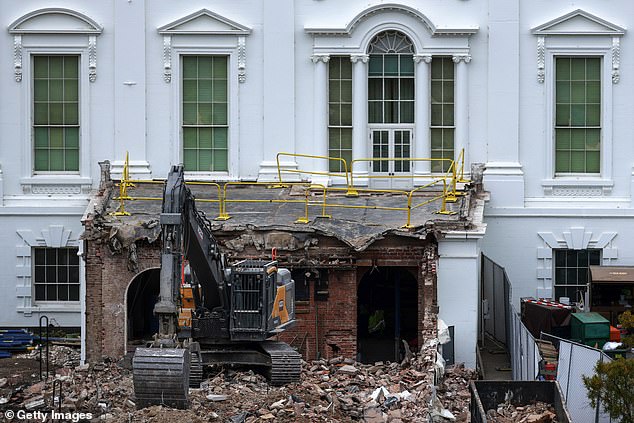 An excavator sits on the rubble after the East Wing of the White House was demolished on October 28  in Washington, DC