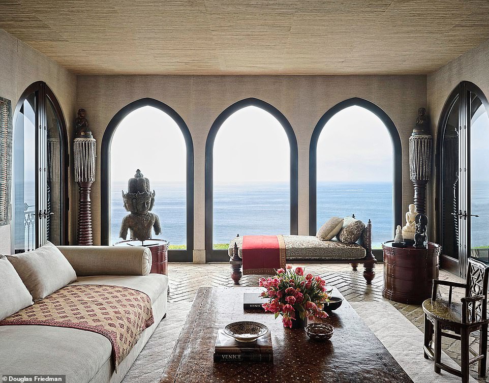 The family room overlooks the ocean, and features a ceremonial Tibetan elephant drum on which stands a 17th-century gilded terracotta monk. The Indian day bed is the best spot from which to take in that view, and the Ottoman-style sofa is perfect for watching TV.