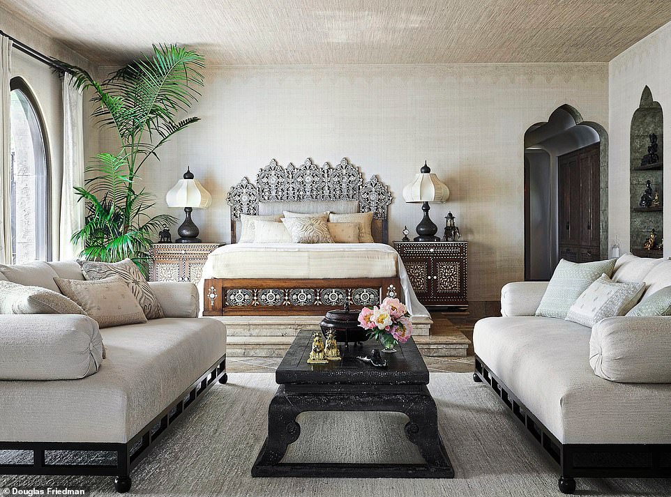 In Cher’s bedroom, the walls are clad in raw silk and stencilled using a mixture of tea leaves and coffee grounds, blended with umber pigments to recreate henna designs painted on the star’s hands during a wedding she attended in India. The bed is 20s-vintage, inlaid with ebony and mother of pearl. ‘My bedroom has been my sanctuary,’ says Cher.