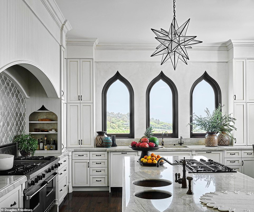 In the kitchen, interior designer Martyn Lawrence Bullard used limestone and marble countertops, imported from Italy and France, and hardware and tiles from Morocco and Spain. A Moravian glass star is a focal point – try etsy.com for a selection. For similar silver wall tiles, try luxurytiles.co.uk.