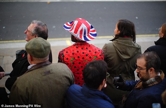 People gather on Whitehall ahead of the Remembrance Sunday service at the Cenotaph in London. Picture date: Sunday November 9, 2025. PA Photo. Photo credit should read: James Manning/PA Wire