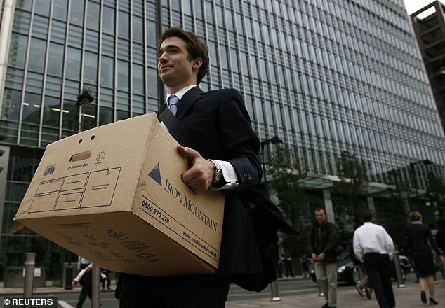A worker carries a box out of the Lehman Brothers offices in London on September 15, 2008