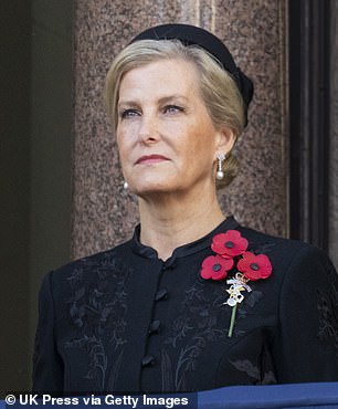 She watched on solemnly