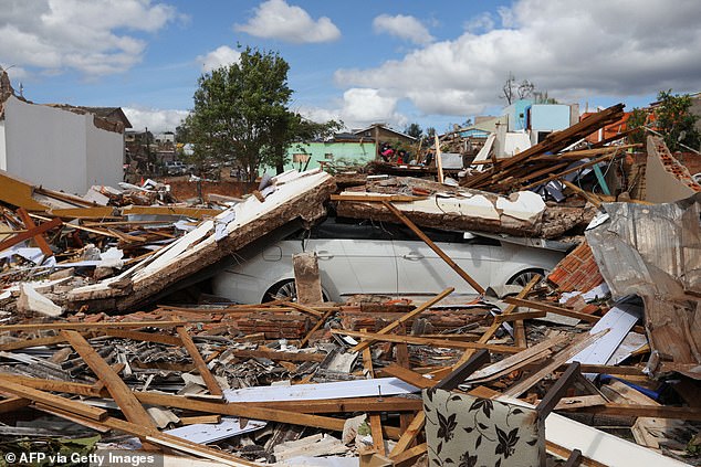 The rapid but mighty tornado destroyed around 90 per cent of the town of Rio Bonito do Iguacu, with images showing the area almost completely flattened