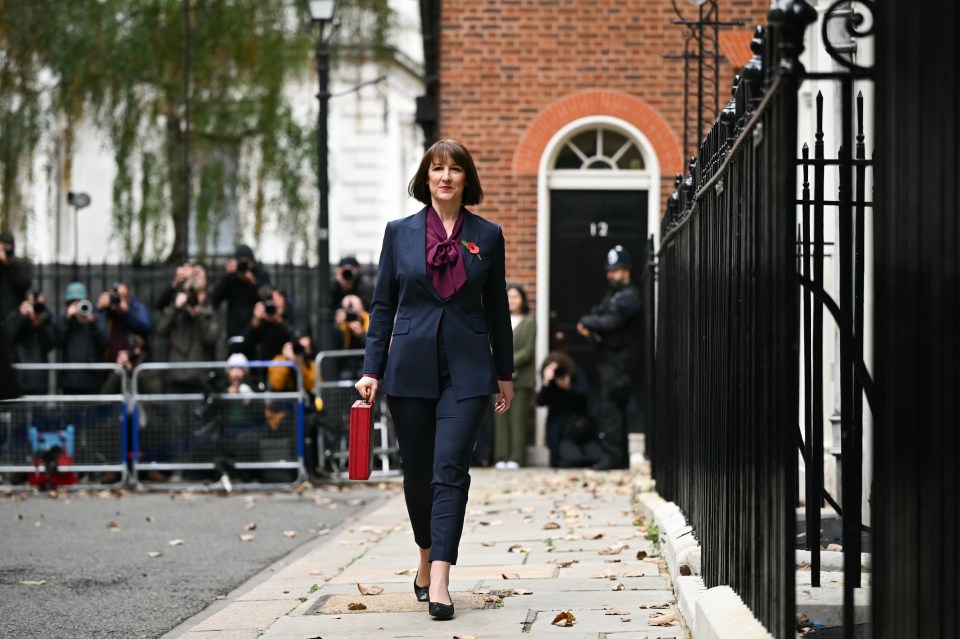 Britain's Chancellor of the Exchequer Rachel Reeves carries the red Budget Box.