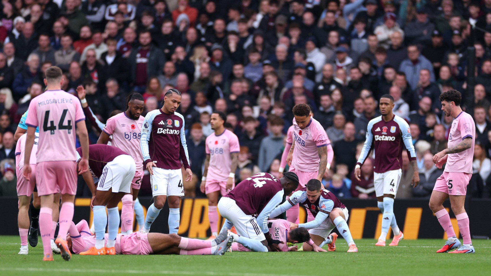 Bournemouth stars Tyler Adams and Adam Smith collapse to floor with nasty head injuries as Aston Villa clash suspended