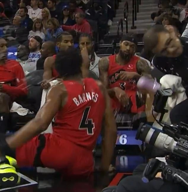 Ingram didn't appear to apologize or offer to help clean up, instead just watching on courtside