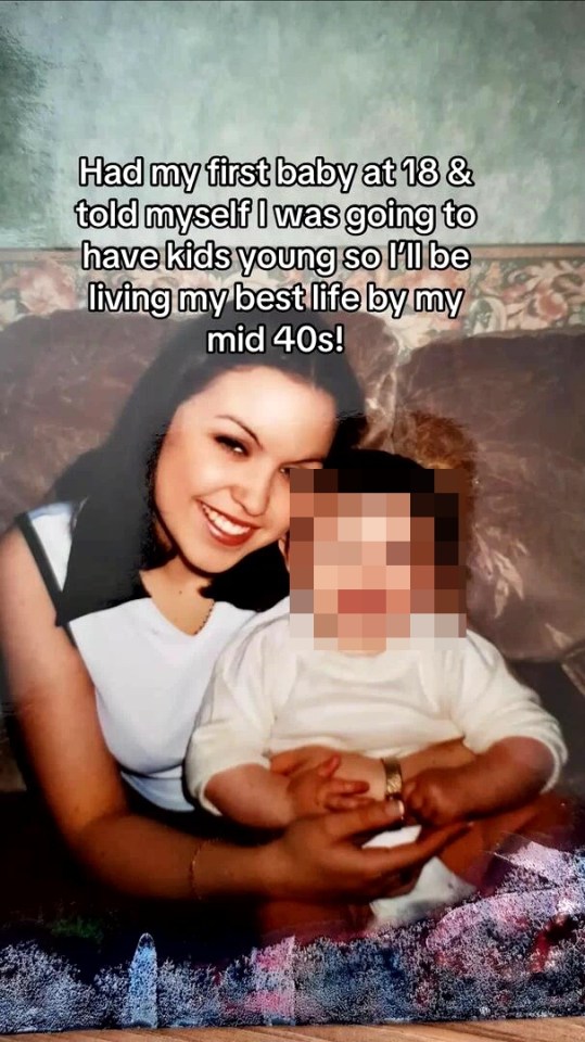 A young woman smiling and holding a baby, with text overlay "Had my first baby at 18 & told myself I was going to have kids young so I'll be living my best life by my mid 40s!"