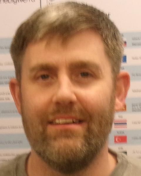 Jamie Sherfield, a white man with grey hair, a full beard, and blue eyes.