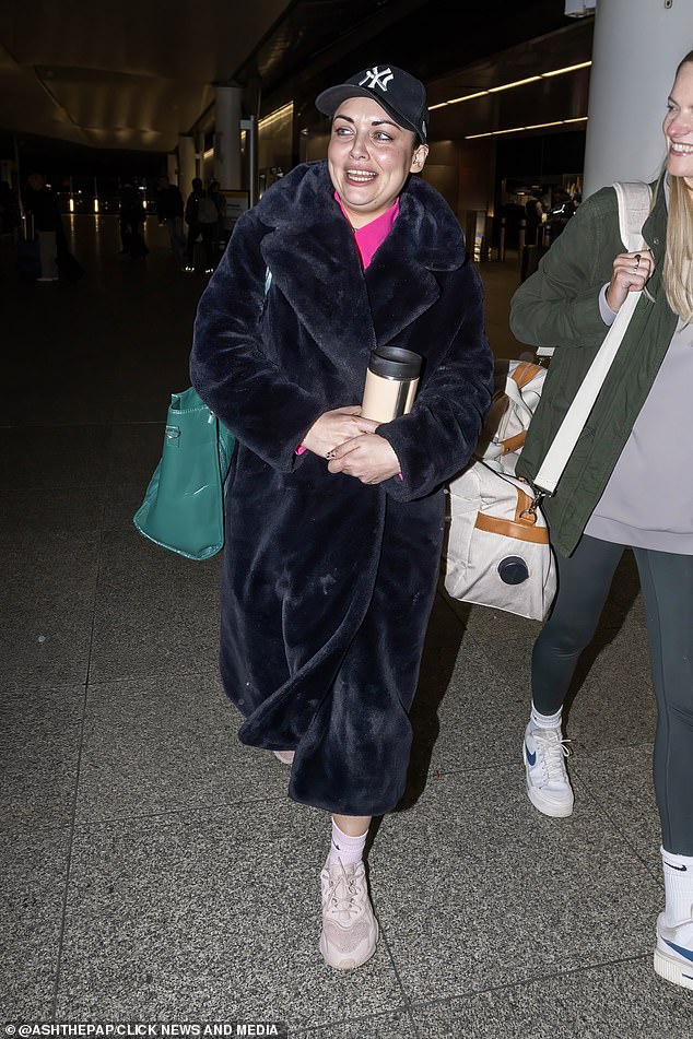 Shona looked in good spirits as she prepared to board her flight on Heathrow on Saturday