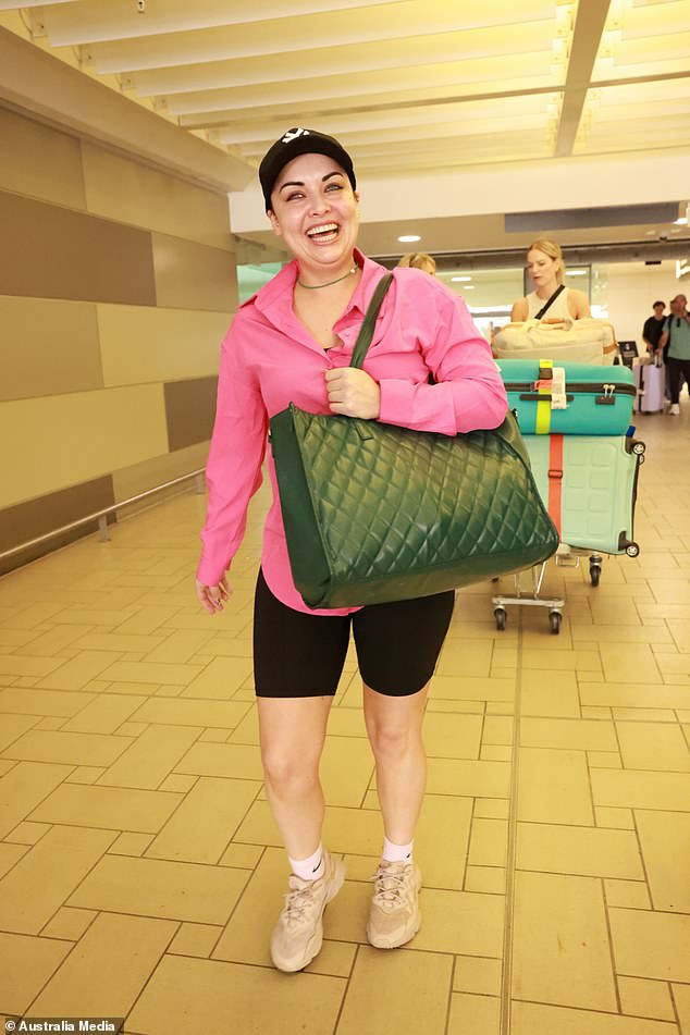 The actress, 34, who played Whitney Dean from 2008 to 2024 on the BBC soap wore a bright pink shirt, black cycling shorts and a baseball cap