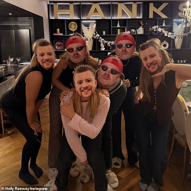 The party appeared to have had an incredibly fun time as they playfully posed in masks of her husband's face