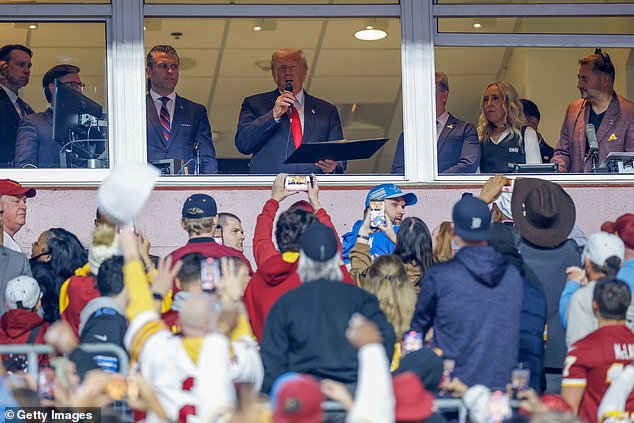 Trump seemed momentarily taken aback by booing when he addressed the crowd at halftime