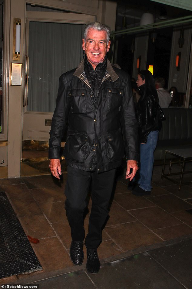 Pierce looked delighted to be in the company of Christopher and Dylan