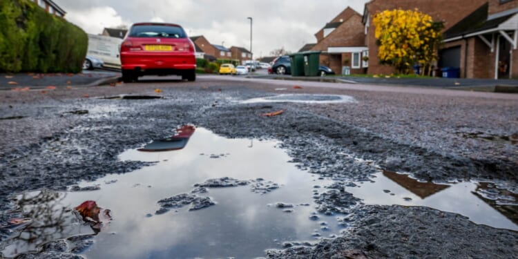 Furious residents told to wait 103 YEARS for their pothole riddled road to be resurfaced