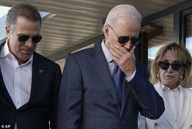 In announcing his death, the then vice president described as 'the finest man' he had ever known. Biden is pictured here reacting to a plaque dedicated to his late son
