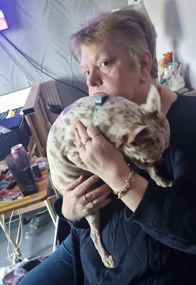 Sarah Barker, 62, is seen with the dog they adopted from Ms Slaney-Summers