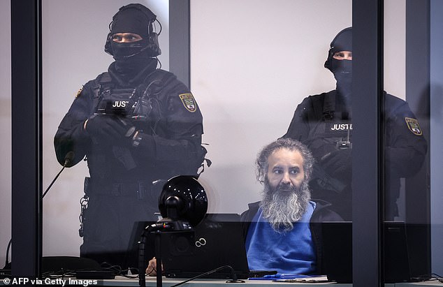 Police stand guard as Abdulmohsen sits for his trail. The case sparked outrage in Germany and renewed calls for a review into the country's immigration policy