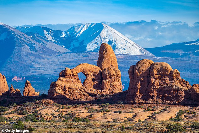 Arches National Park is home to more than 2,000 natural, red-hued, sandstone arches which tower over the picturesque desert landscape framed by jagged peaks