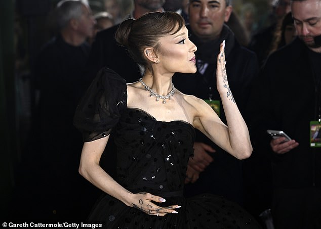 After recently returning to her natural brunette look, Ariana swept her tresses into a high bun as she blew kisses to the fans at the premiere