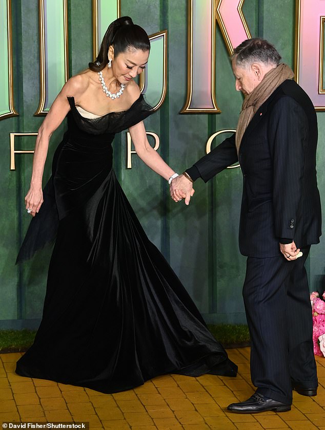 Ever the gentleman, Jean offered a helping hand for Michelle as she made her way along the yellow brick road to pose for photos