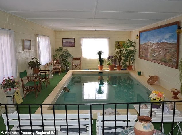 The fascinating cave-like home even boasts a huge swimming pool next to the living area