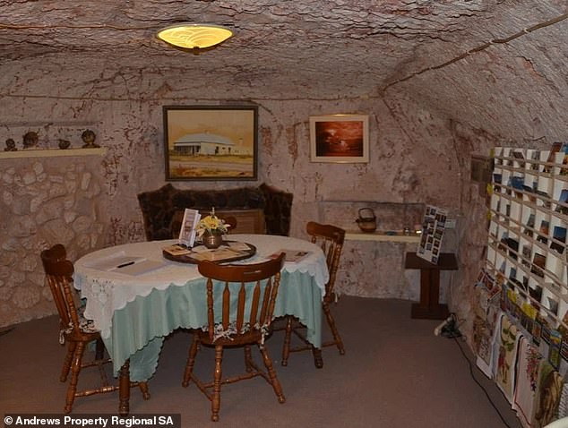 There are six main rooms in the underground home, including the dining area (pictured), three bedrooms, kitchen, lounge, bar, and that famous swimming pool