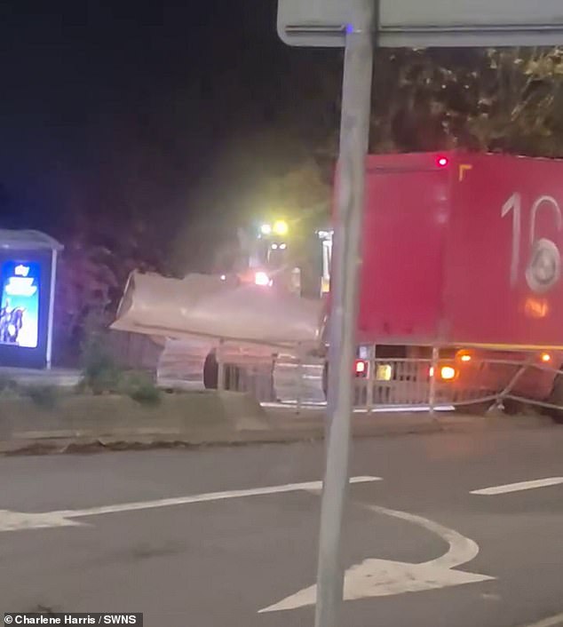 Videos show the bulldozer ramming a Royal Mail lorry out of the way and forcing it into railings
