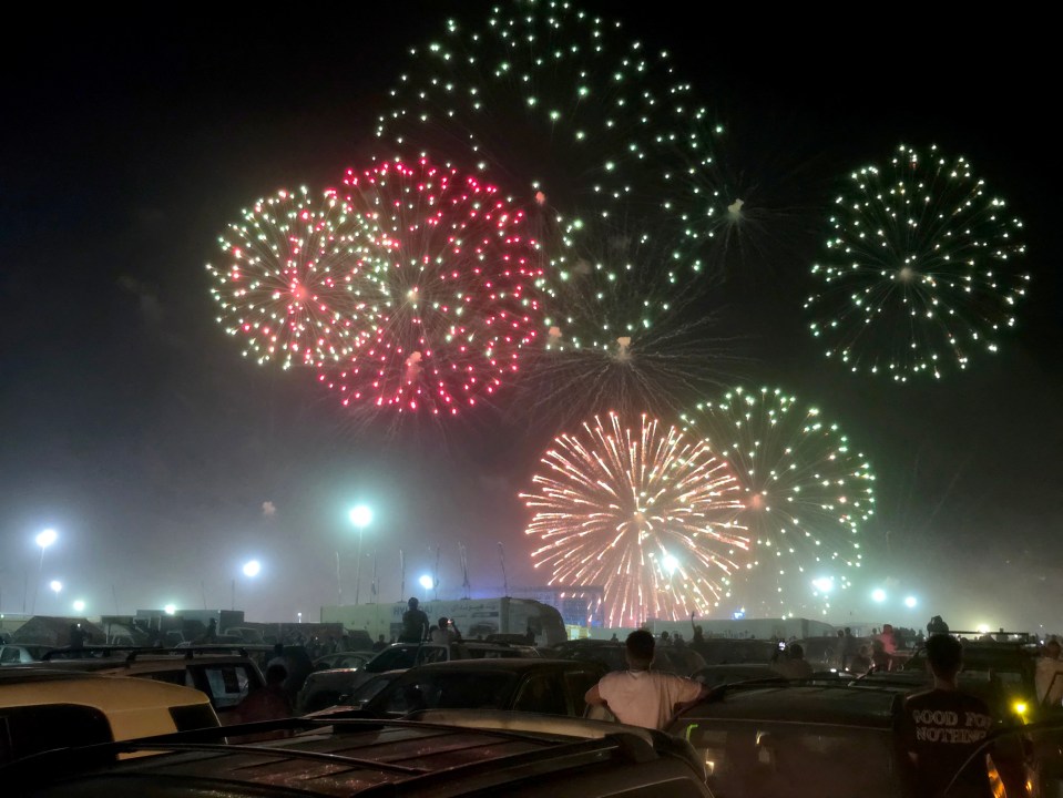 Fireworks light up the night sky at the end of the second stage of the 2025 4x4 Tete Desert Rally in Waddan, Libya.