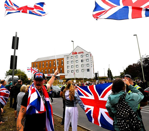 The hotel where Ahmedsalih was being held was the site of anti-migrant protests(pictured) just three days before he attacked the police officers