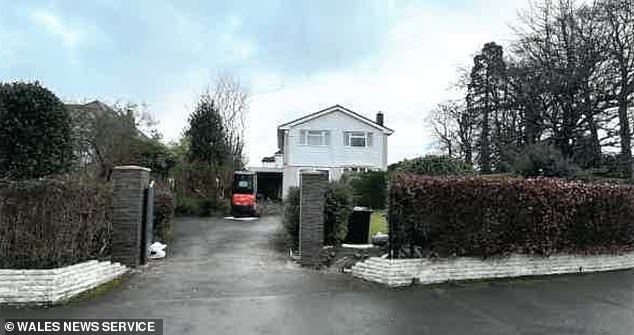 Pictured: the house before the fence. A councillor said she preferred the hedge which stood before