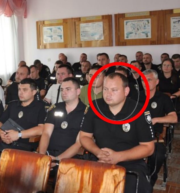 The Daily Mail can reveal that Starovoitov (circled) was actually a senior police officer back in his home country