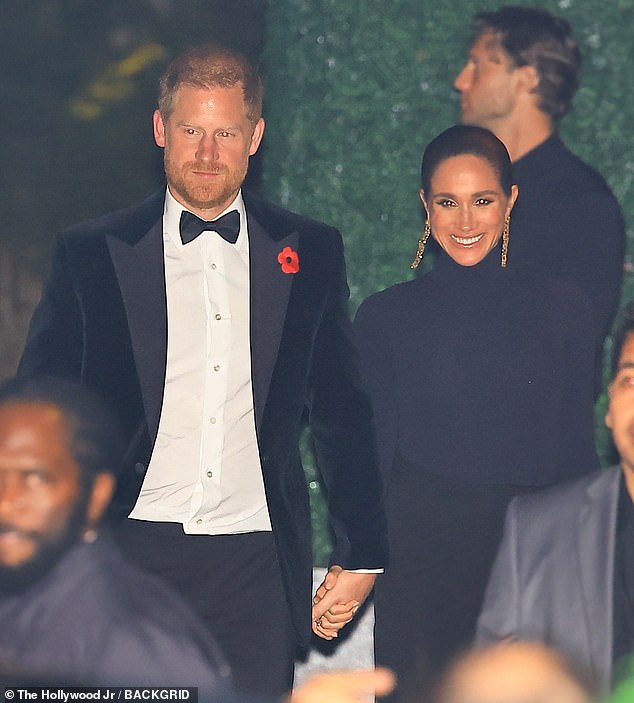 Meanwhile, Harry stuck to the classic look of a black tuxedo and bow tie. He wore a poppy in honor of Remembrance Day, which senior members of the Royal Family commemorated at the Cenotaph in London on Sunday, while Meghan did not wear one
