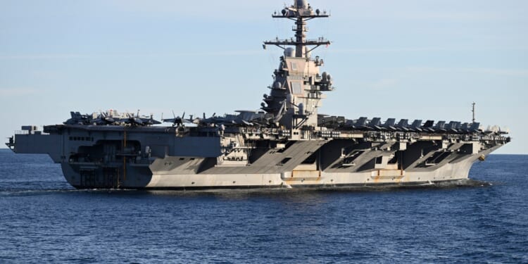 Donald Trump moves world's largest aircraft carrier towards Venezuela as Maduro prepares to fight guerrilla war