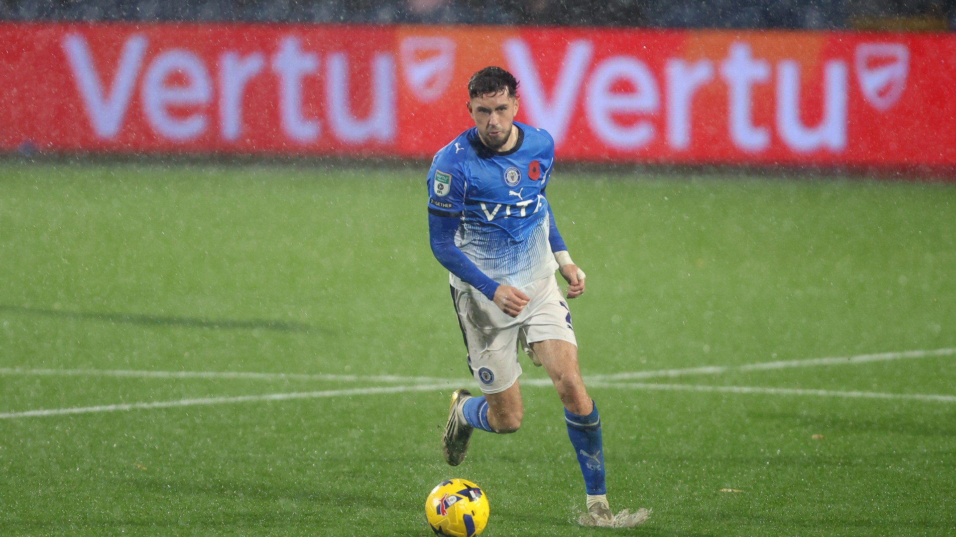 Stockport vs Wigan SUSPENDED as Vertu Trophy clash battered by torrential downpour and ball barely moving