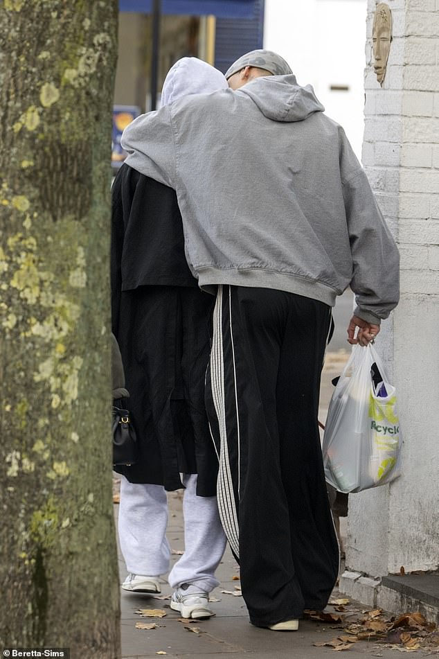 While Kim wore a dark coat and comfy co-ord with her hood up to keep a low profile