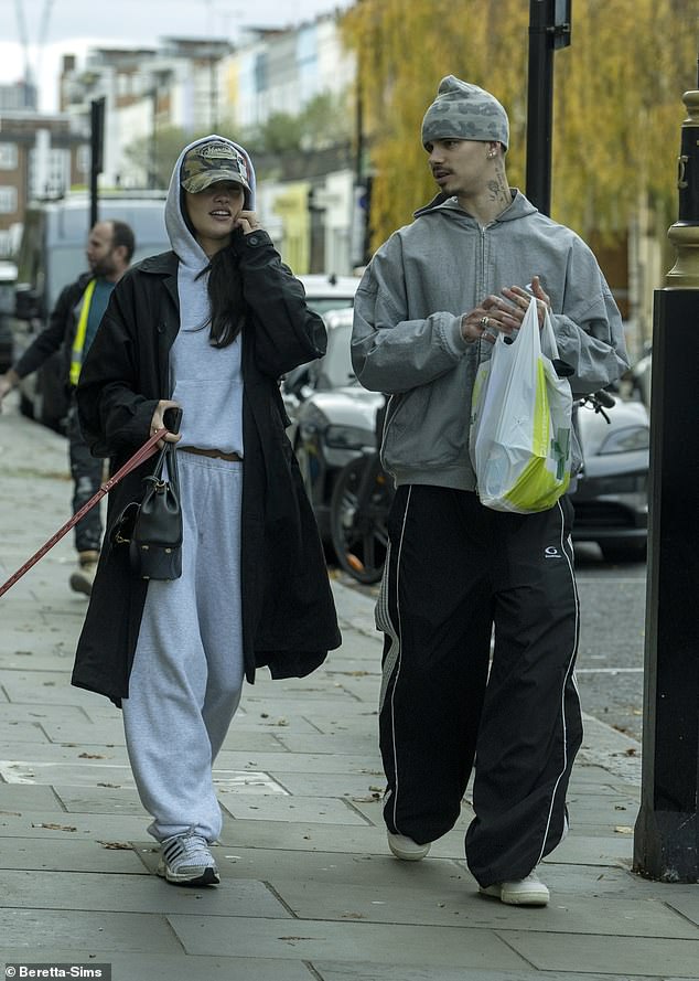 Kim held her dog on a lead during the outing