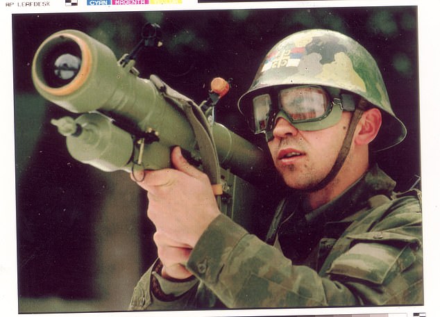 An identified Bosnian Serb soldier in 1994 aims an anti aircraft missile at overflying NATO warplanes flying over Serbian positions on Mount Trebevic