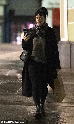 She then appeared to call someone as she made her way home