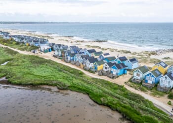 Fuming beach hut owners in UK coastal town say seaside bar is turning their home into an 'Ibiza rave scene'