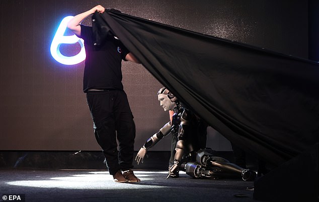 A black sheet was raised to shield the robot from the audience as it was dragged off-stage