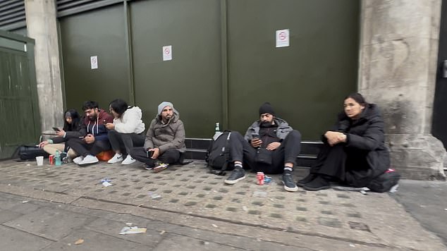 The inhabitants are a mix of male migrants from the Middle East, a few Englishmen, and a small number of women who beg for money nearby