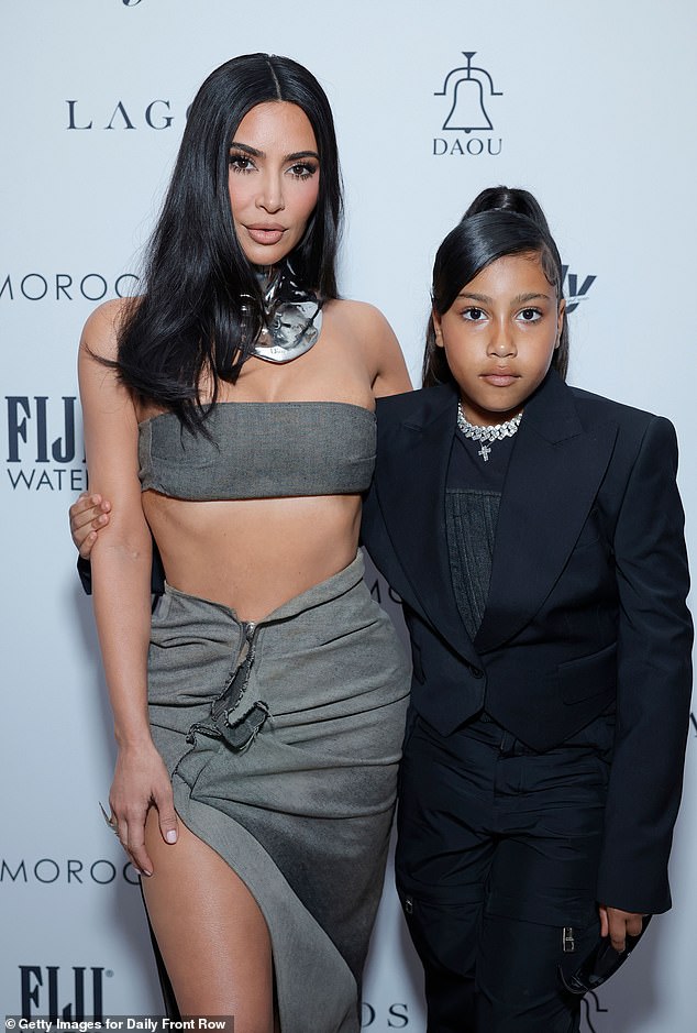 Last month, the reality star, 44, came under fire over the summer for letting North West wear a corset during an outing in Rome (pictured in 2023)